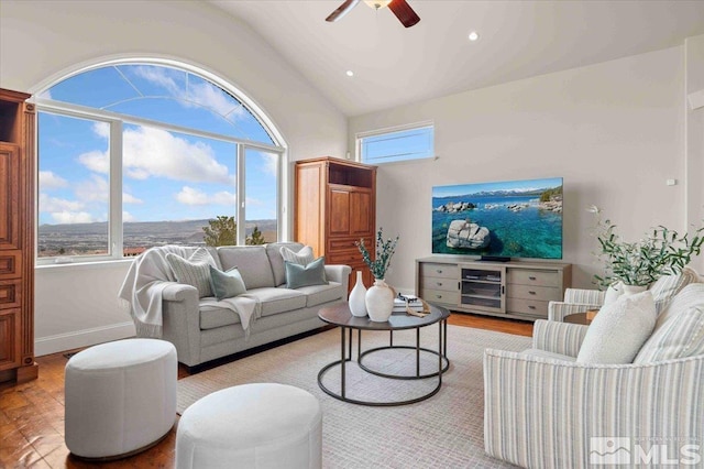 1005 Desert Jewel Ct, Reno, NV 89511 - living area with lofted ceiling, wood finished floors, a ceiling fan, and baseboards