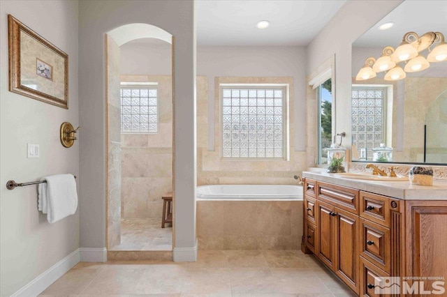 1005 Desert Jewel Ct, Reno, NV 89511 - bathroom with a garden tub, vanity, tiled shower, tile patterned floors, and recessed lighting