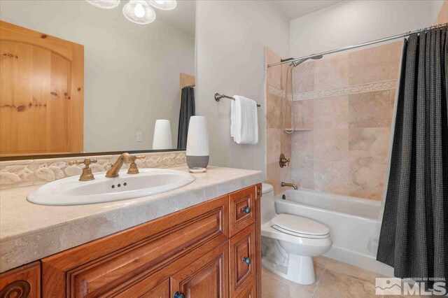 1005 Desert Jewel Ct, Reno, NV 89511 - full bathroom with toilet, shower / bath combo with shower curtain, vanity, and tile patterned flooring