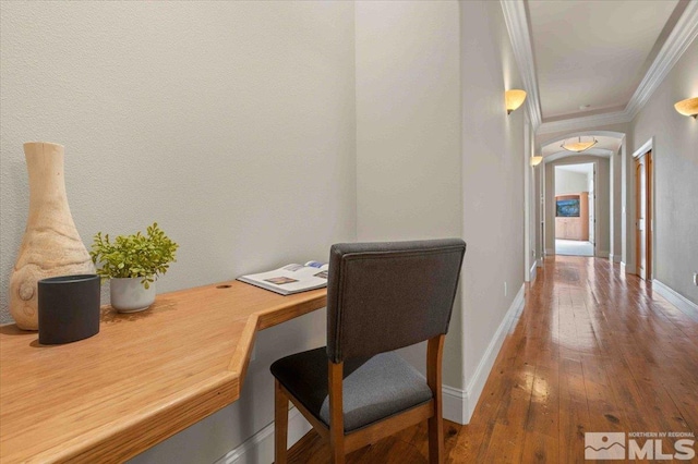 1005 Desert Jewel Ct, Reno, NV 89511 - home office featuring ornamental molding, arched walkways, wood-type flooring, and baseboards