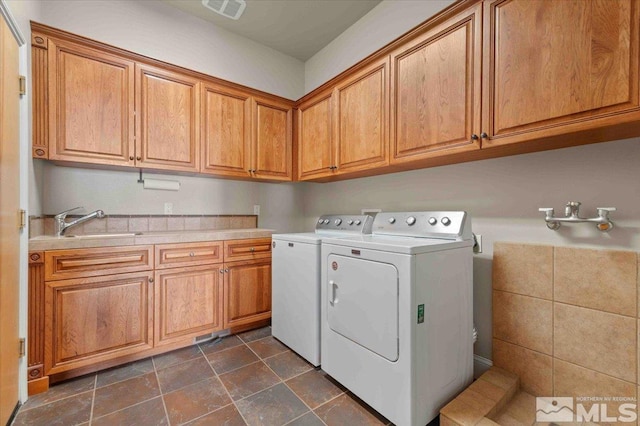 1005 Desert Jewel Ct, Reno, NV 89511 - laundry area with cabinet space and washing machine and dryer