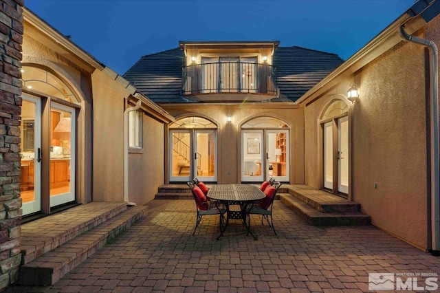 1005 Desert Jewel Ct, Reno, NV 89511 - view of patio with a balcony, entry steps, and french doors