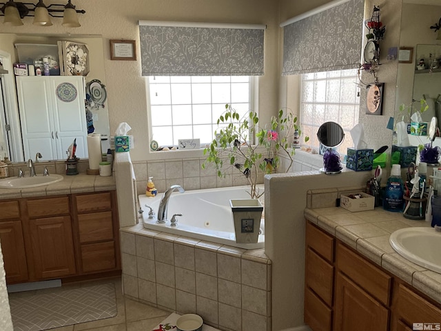 5710 Sarah Rd, Fallon, NV 89406 - full bath featuring plenty of natural light, two vanities, a whirlpool tub, and tile patterned floors