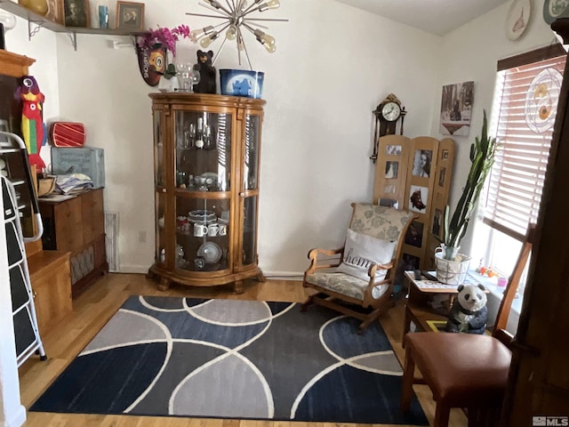 5710 Sarah Rd, Fallon, NV 89406 - sitting room with wood finished floors and a chandelier