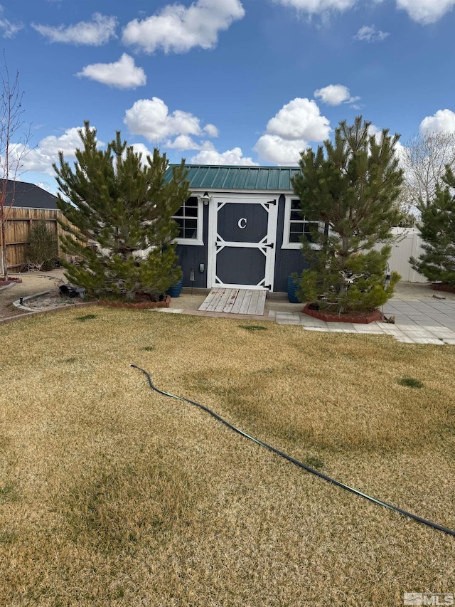 5710 Sarah Rd, Fallon, NV 89406 - view of front of home with a shed, an outdoor structure, and metal roof