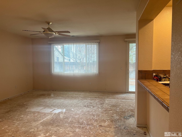 1425 Loma Verde Dr, Sparks, NV 89436 - empty room with plenty of natural light and ceiling fan