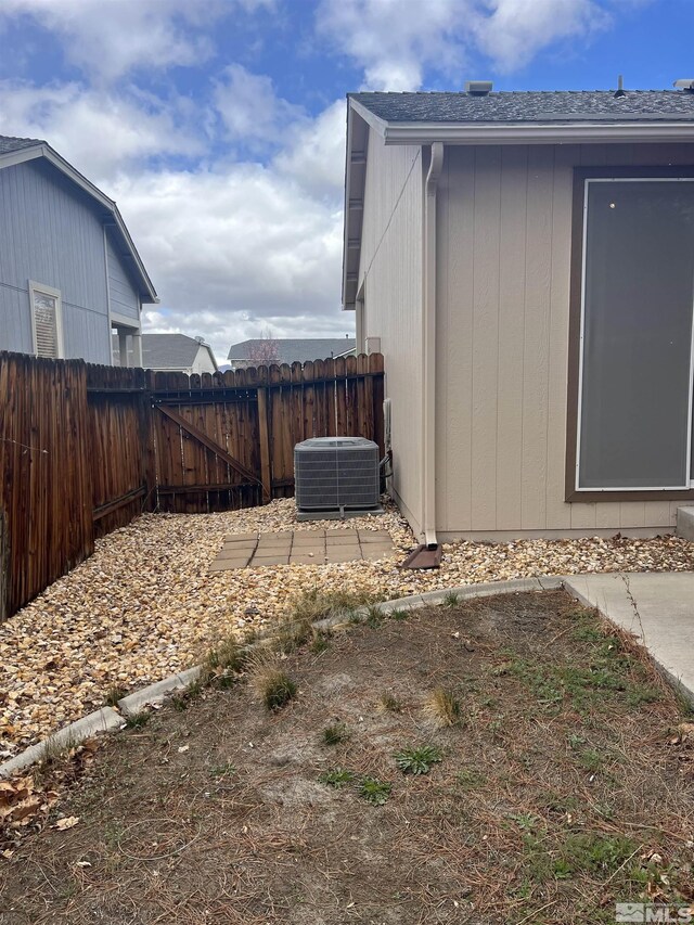 1425 Loma Verde Dr, Sparks, NV 89436 - view of property exterior featuring central AC and fence