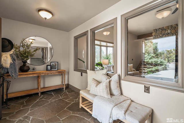 4840 Keshmiri Pl, Reno, NV 89519 - living area with stone flooring, healthy amount of natural light, and baseboards