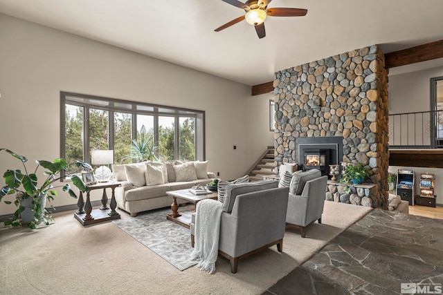 4840 Keshmiri Pl, Reno, NV 89519 - carpeted living room with a ceiling fan, a fireplace, beamed ceiling, and stairway