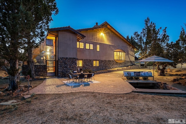 4840 Keshmiri Pl, Reno, NV 89519 - back of house featuring a patio area and stone siding