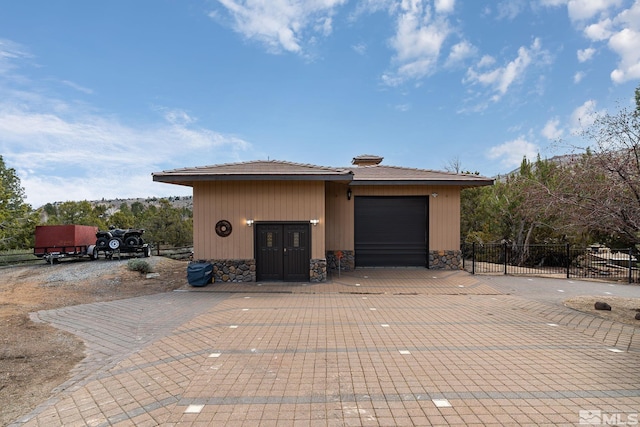 4840 Keshmiri Pl, Reno, NV 89519 - garage with fence and decorative driveway