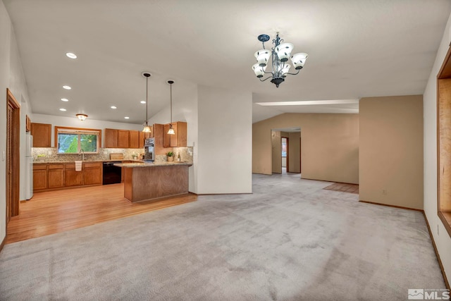 2080 Rock Haven Dr, Reno, NV 89511 - kitchen featuring black dishwasher, open floor plan, brown cabinetry, vaulted ceiling, and light colored carpet