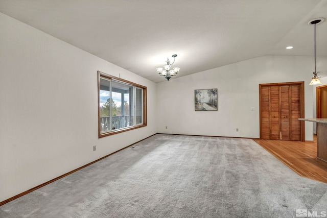 2080 Rock Haven Dr, Reno, NV 89511 - unfurnished room with a chandelier, carpet floors, vaulted ceiling, baseboards, and recessed lighting