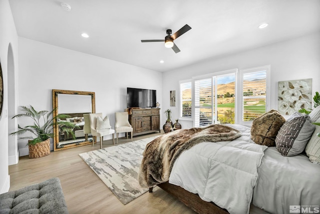 bedroom with wood finished floors, recessed lighting, and ceiling fan