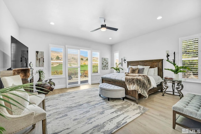 bedroom featuring access to exterior, light wood finished floors, recessed lighting, a ceiling fan, and baseboards