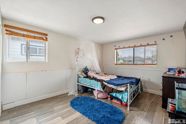 11 E P St, Sparks, NV 89431 - bedroom featuring a wainscoted wall and hardwood / wood-style floors