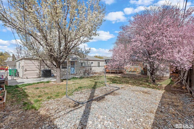 11 E P St, Sparks, NV 89431 - view of yard with a trampoline, fence, and cooling unit