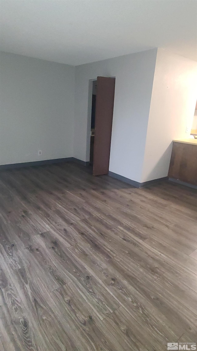 2450 Lymbery St Unit 118, Reno, NV 89509 - spare room featuring dark wood-style flooring and baseboards
