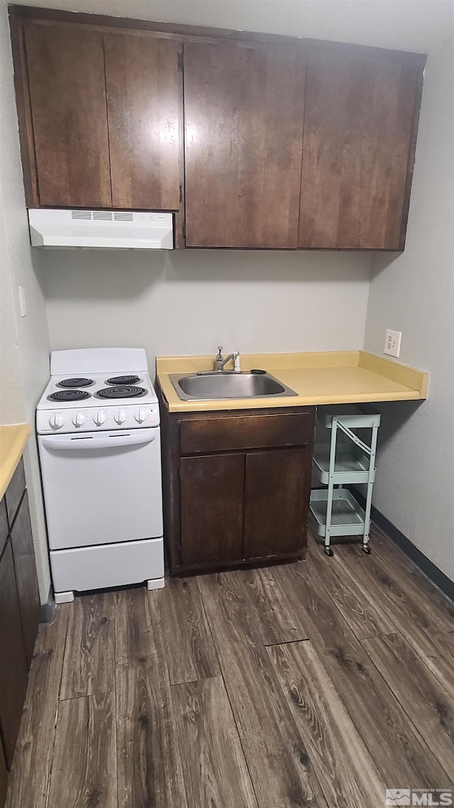 2450 Lymbery St Unit 118, Reno, NV 89509 - kitchen with white range with electric stovetop, under cabinet range hood, a sink, and dark wood-type flooring