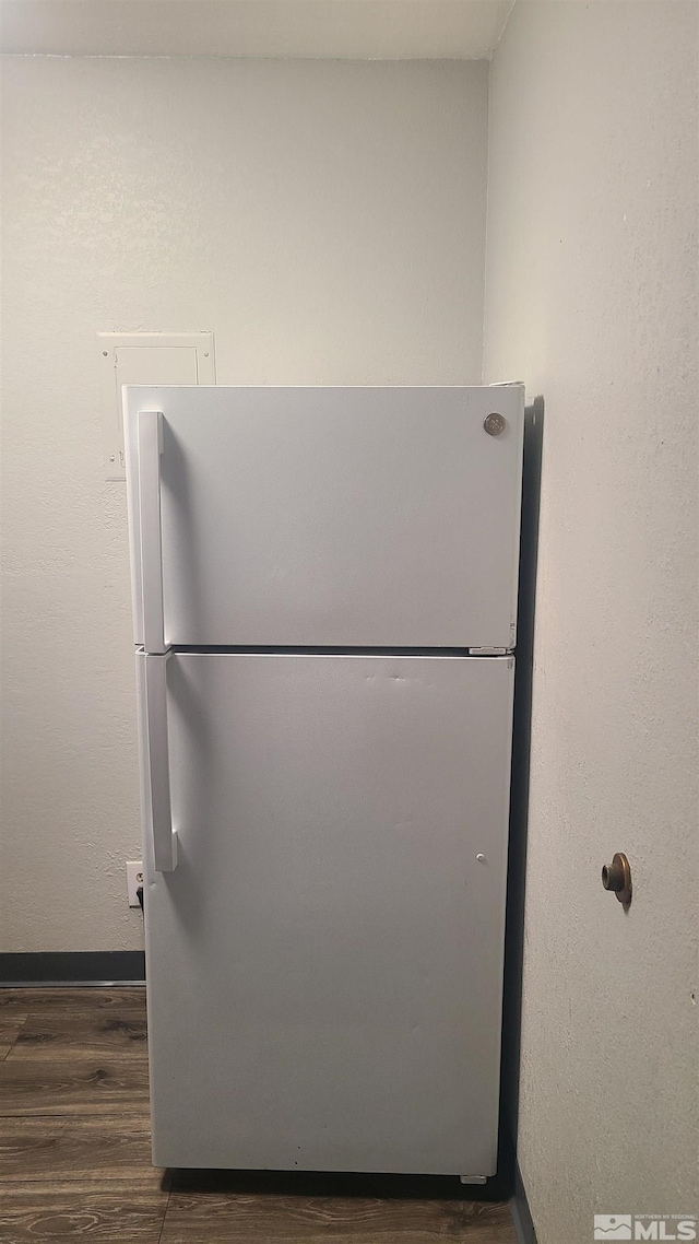2450 Lymbery St Unit 118, Reno, NV 89509 - kitchen view of freestanding refrigerator, wood finished floors, and baseboards