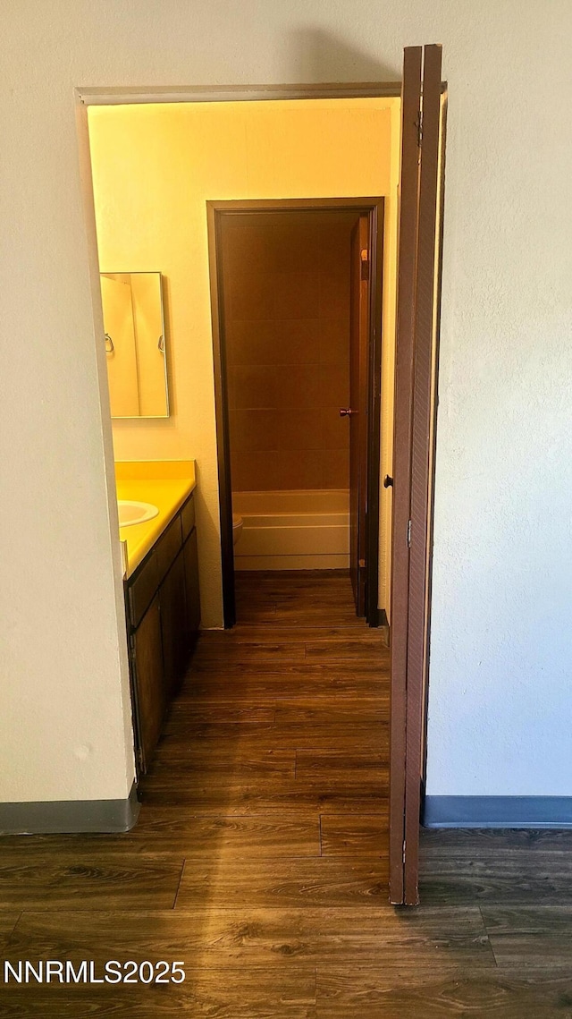 2450 Lymbery St Unit 118, Reno, NV 89509 - hallway with dark wood finished floors and baseboards