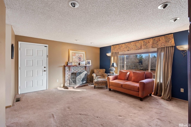 living room with carpet, a fireplace, and a textured ceiling