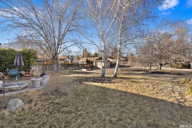 view of yard with a shed and an outbuilding