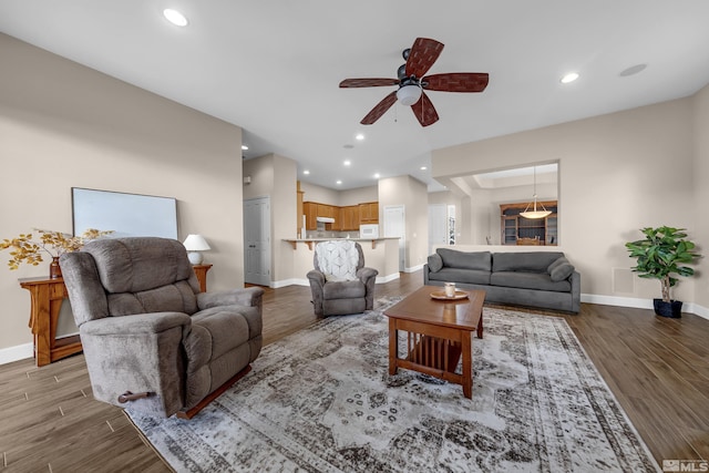 5807 Desert Mirage Dr, Sparks, NV 89436 - living room with ceiling fan, baseboards, wood finished floors, and recessed lighting