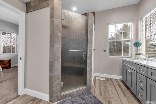 5807 Desert Mirage Dr, Sparks, NV 89436 - full bath featuring vanity, a shower stall, wood finished floors, and baseboards