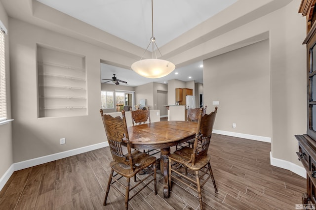 5807 Desert Mirage Dr, Sparks, NV 89436 - dining room with wood finished floors, baseboards, recessed lighting, ceiling fan, and a tray ceiling