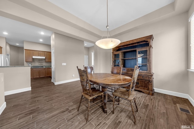 5807 Desert Mirage Dr, Sparks, NV 89436 - dining space featuring baseboards, dark wood-style floors, and recessed lighting