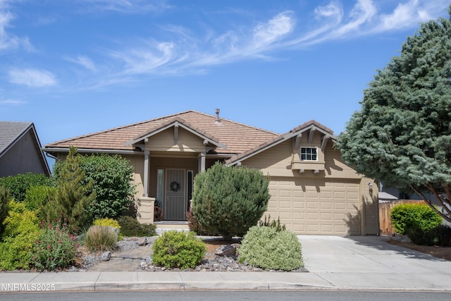 5807 Desert Mirage Dr, Sparks, NV 89436 - craftsman inspired home with driveway, a tile roof, and a garage
