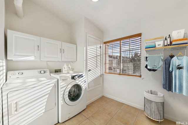 5765 Vista Serena Way Unit 103, Sparks, NV 89436 - laundry room featuring cabinet space, washing machine and clothes dryer, light tile patterned floors, and baseboards