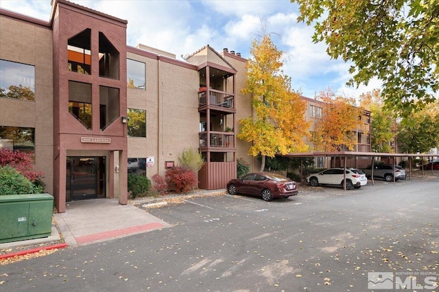 2955 Lakeside Dr Unit 223, Reno, NV 89509 - view of apartment building / complex featuring covered and uncovered parking