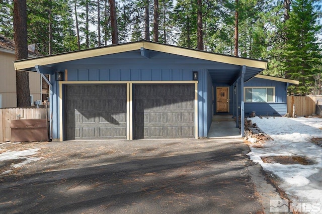 190 Meadow, Stateline, NV 89449 - view of front of property with fence, asphalt driveway, and a garage