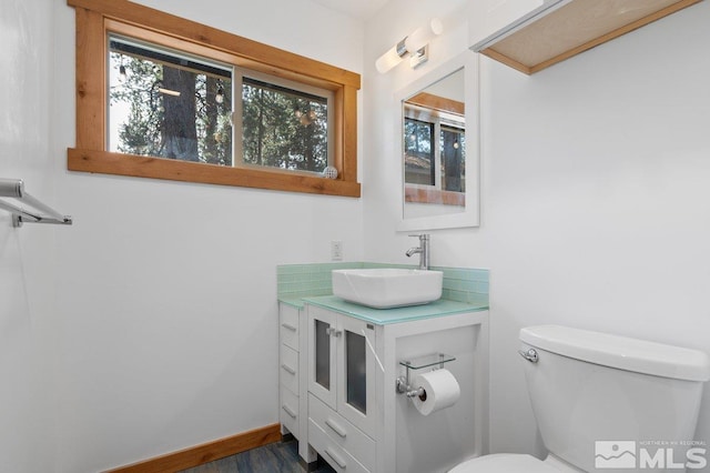 190 Meadow, Stateline, NV 89449 - bathroom featuring toilet, vanity, wood finished floors, and baseboards