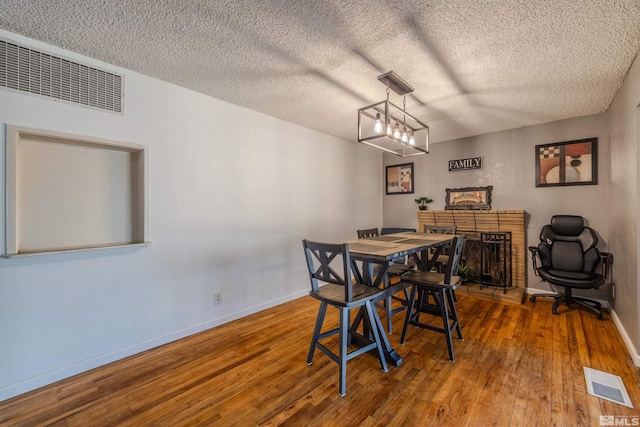 250 Galleron Way, Sparks, NV 89431 - dining area featuring wood-type flooring, baseboards, and a textured ceiling