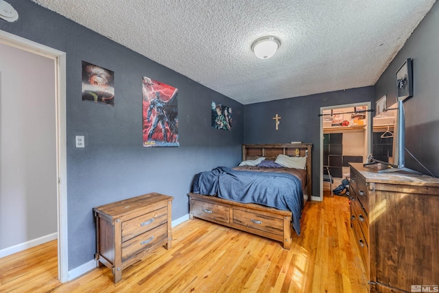 250 Galleron Way, Sparks, NV 89431 - bedroom with wood-type flooring, a textured ceiling, and baseboards