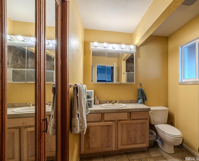 250 Galleron Way, Sparks, NV 89431 - bathroom with toilet, vanity, and tile patterned flooring