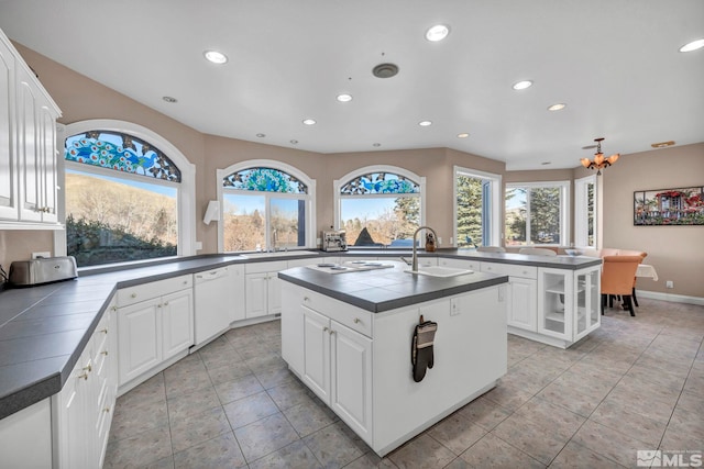 15 Hidden Lake Dr, Reno, NV 89521 - kitchen featuring a sink, recessed lighting, white dishwasher, a kitchen island with sink, and tile countertops