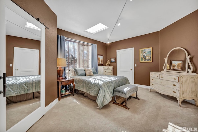 15 Hidden Lake Dr, Reno, NV 89521 - bedroom featuring a skylight, light colored carpet, baseboards, and lofted ceiling