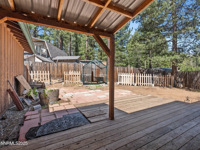 1713 Tionontati St, South Lake Tahoe, CA 96150 - wooden deck featuring a fenced backyard, an exterior structure, and an outbuilding