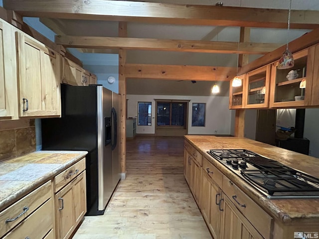21410 Sazarac Rd, Reno, NV 89521 - kitchen featuring gas stovetop, light wood-style flooring, stainless steel fridge, glass insert cabinets, and light countertops