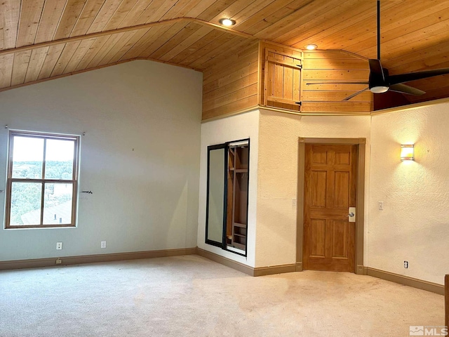 21410 Sazarac Rd, Reno, NV 89521 - spare room with wooden ceiling, vaulted ceiling, a ceiling fan, light colored carpet, and baseboards