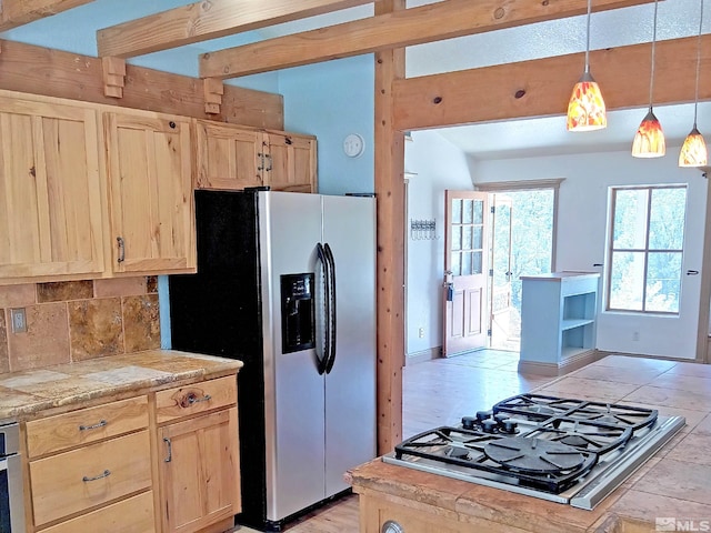 21410 Sazarac Rd, Reno, NV 89521 - kitchen with light brown cabinetry, stainless steel fridge, decorative backsplash, and black gas cooktop