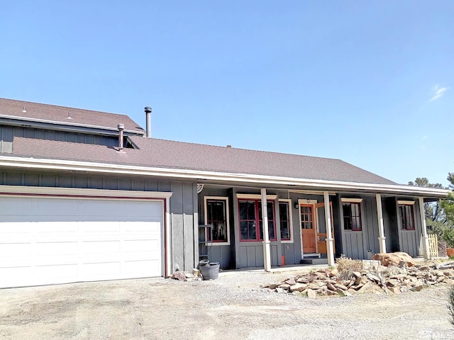 21410 Sazarac Rd, Reno, NV 89521 - view of front of property featuring board and batten siding, covered porch, and an attached garage