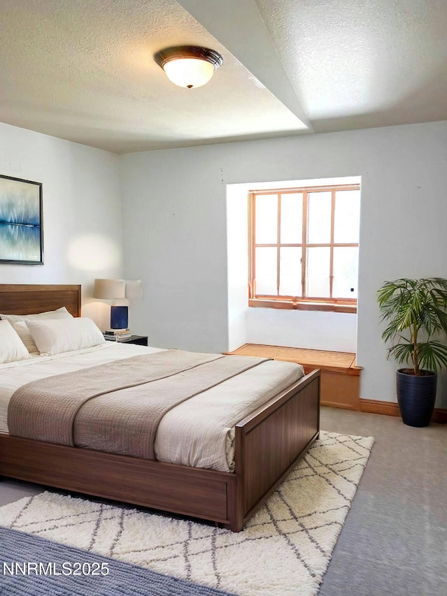 21410 Sazarac Rd, Reno, NV 89521 - carpeted bedroom featuring a textured ceiling and baseboards