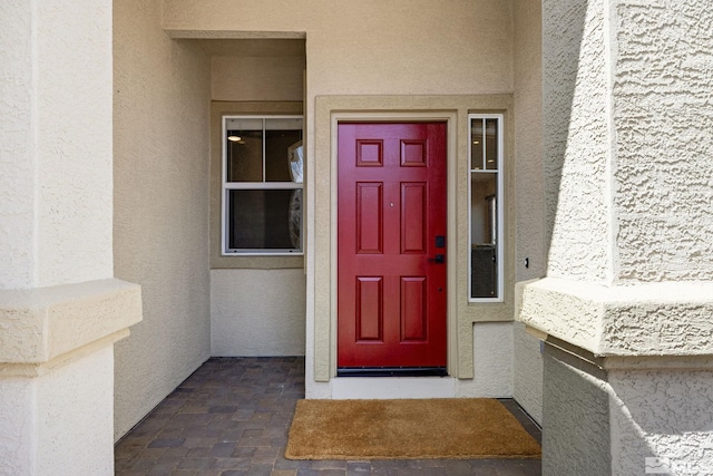 159 River Flow Dr, Reno, NV 89523 - doorway to property featuring stucco siding