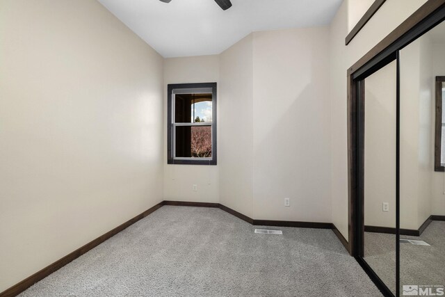 159 River Flow Dr, Reno, NV 89523 - spare room featuring light colored carpet, a ceiling fan, and baseboards