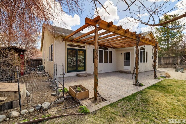 159 River Flow Dr, Reno, NV 89523 - back of property featuring stucco siding, a fenced backyard, a patio area, and a pergola